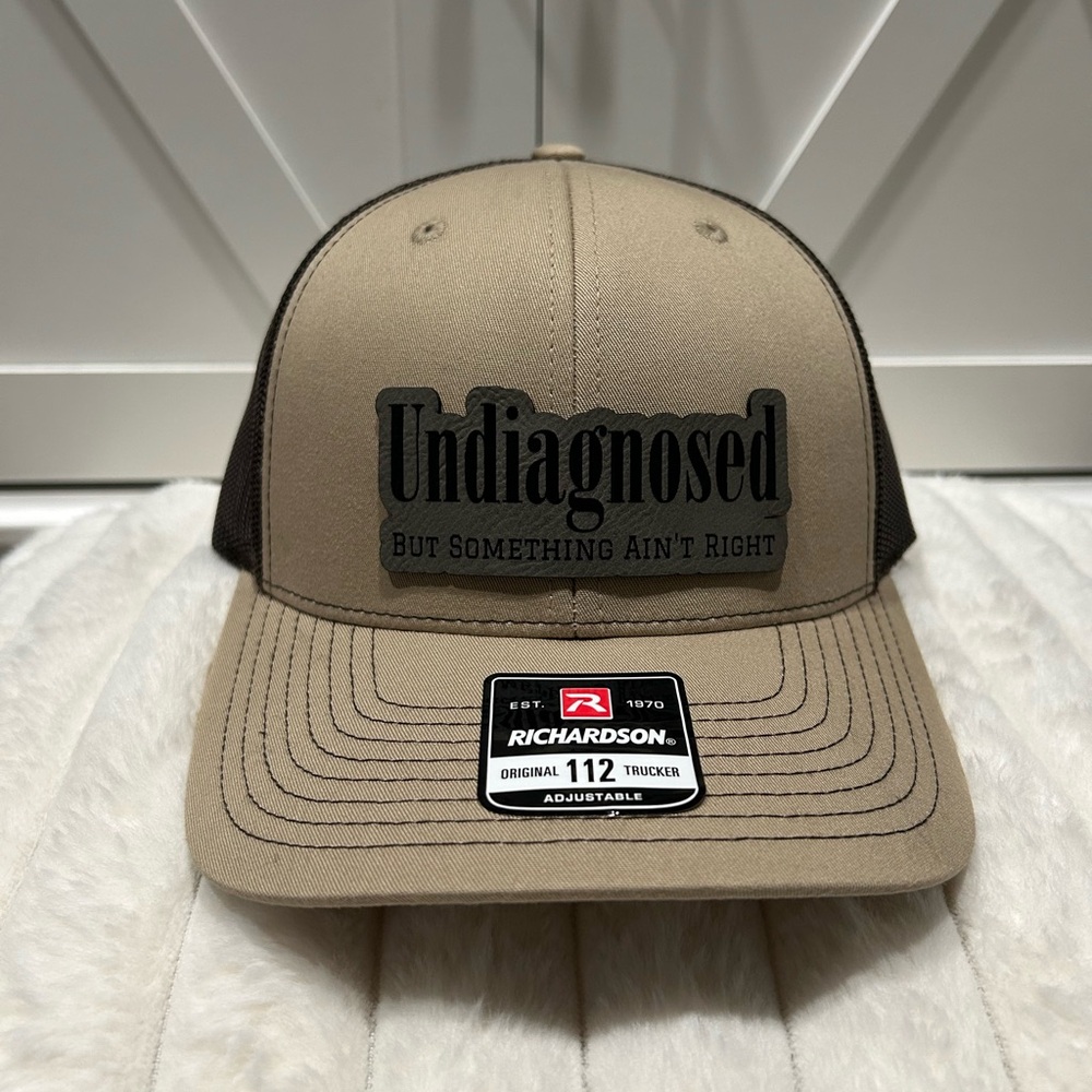 Undiagnosed, but something ain’t right. Richardson trucker hat.